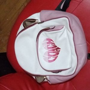 Coach pocketbook pink and white backpack style